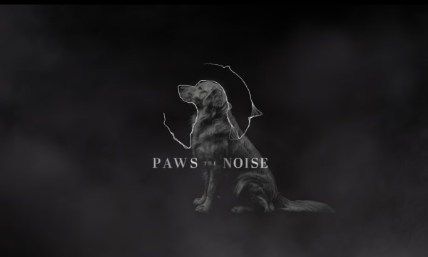 Dog in blanck and white and the name of the campaign in the middle "Paws the noise"