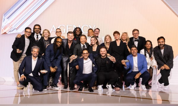 This image shows a group of VMLers posing on stage at an event for "The One Show Awards" by "The One Club for Creativity."