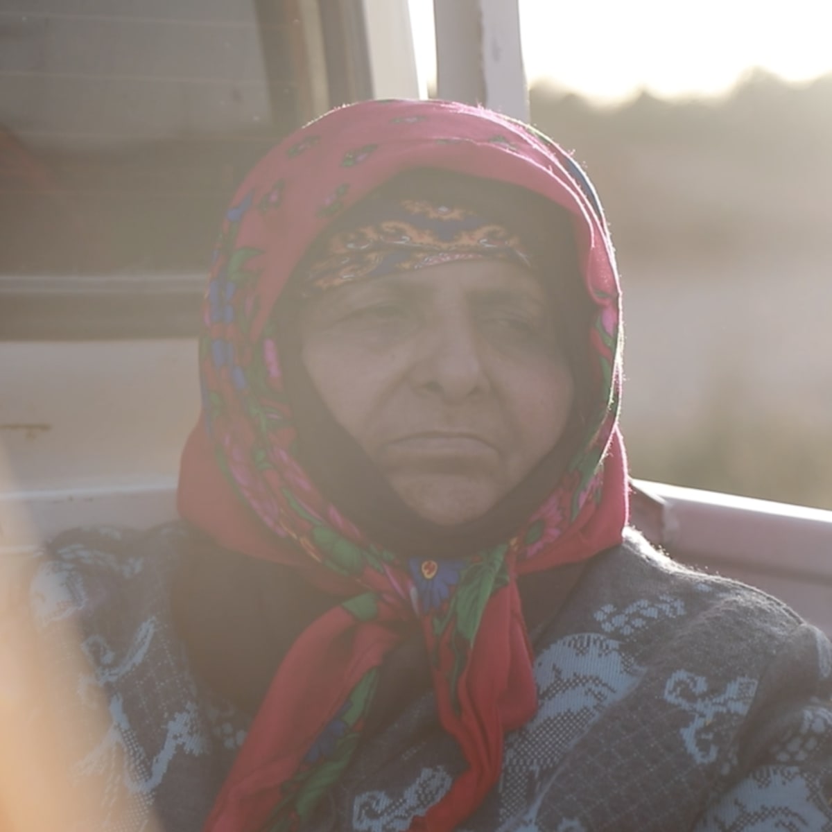 old woman with headscarf