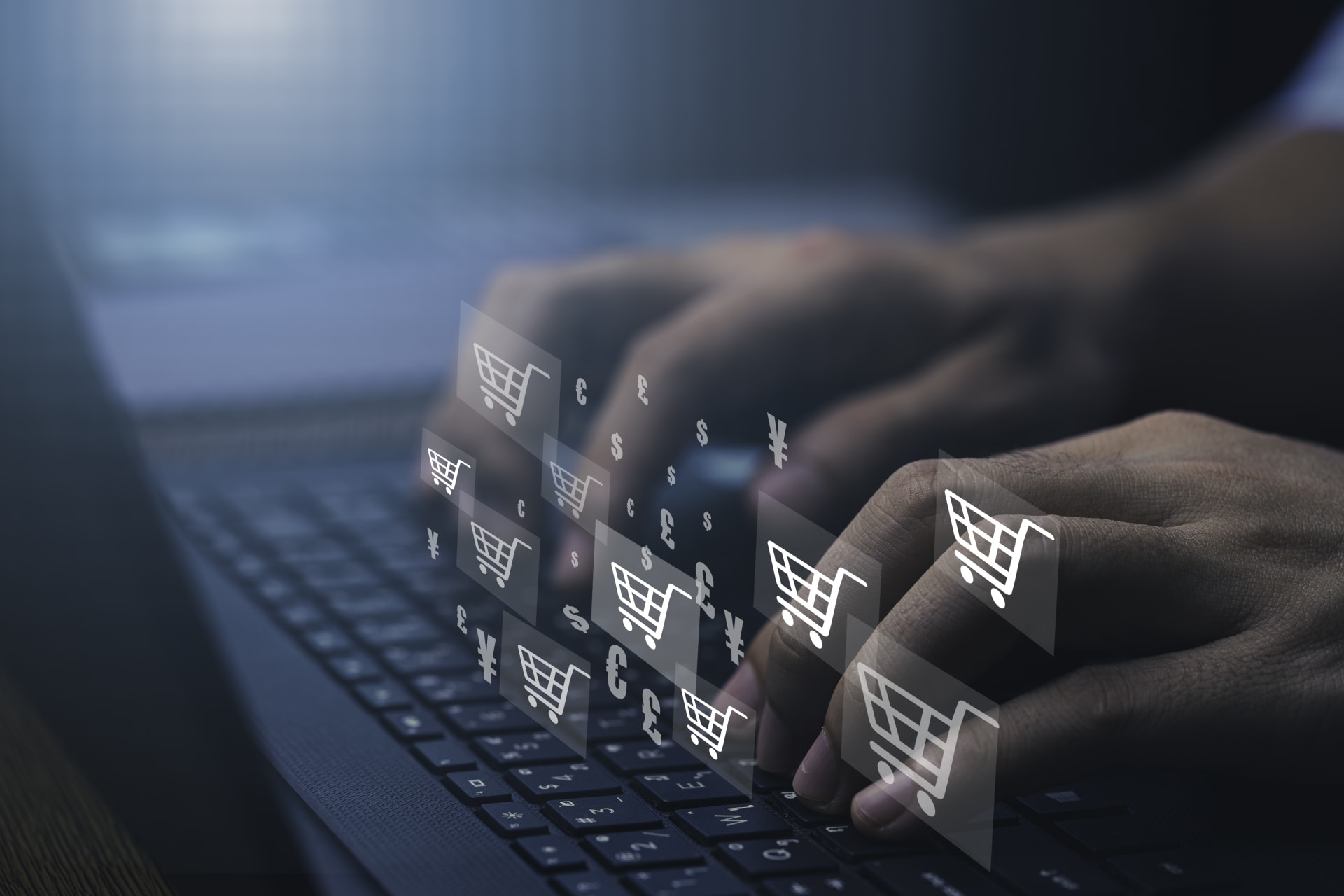 Person typing on keyboard with shopping trolly icons