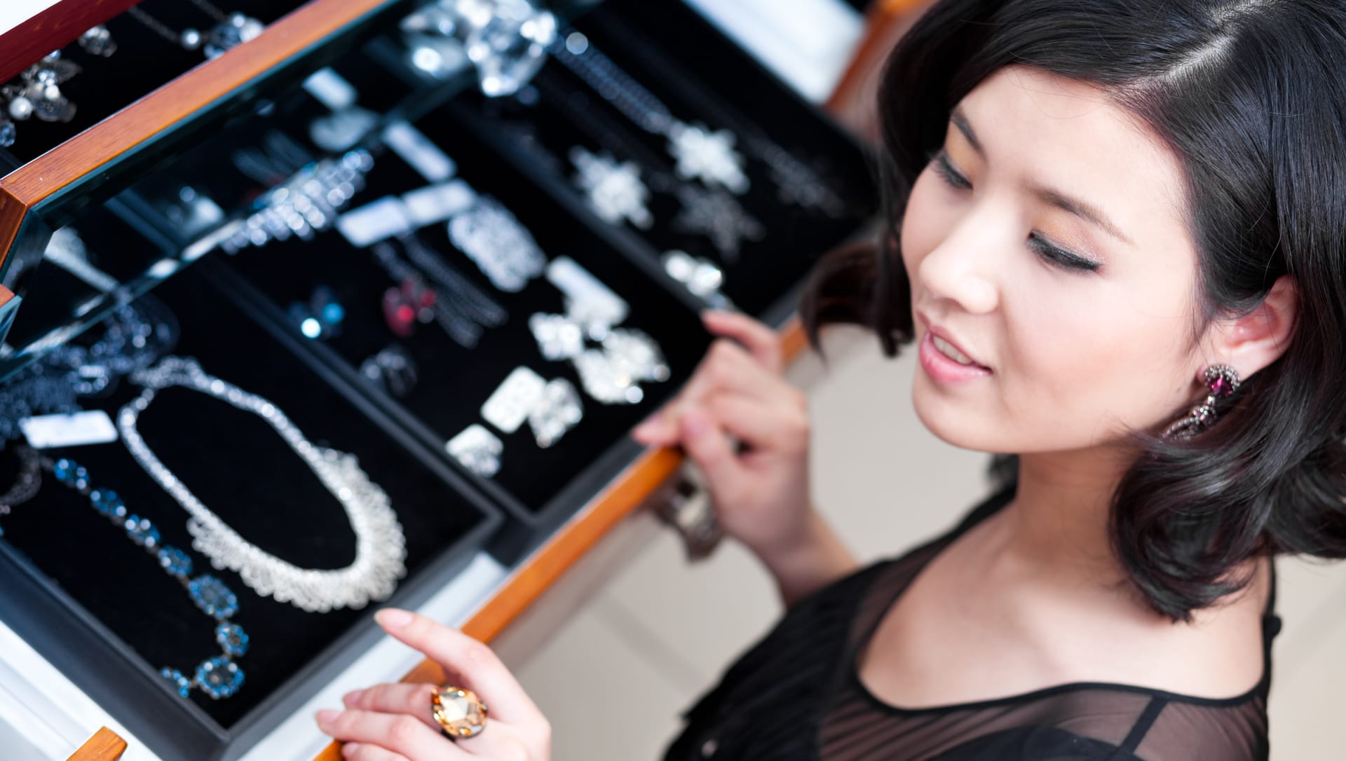 Woman looking at luxury jewelry