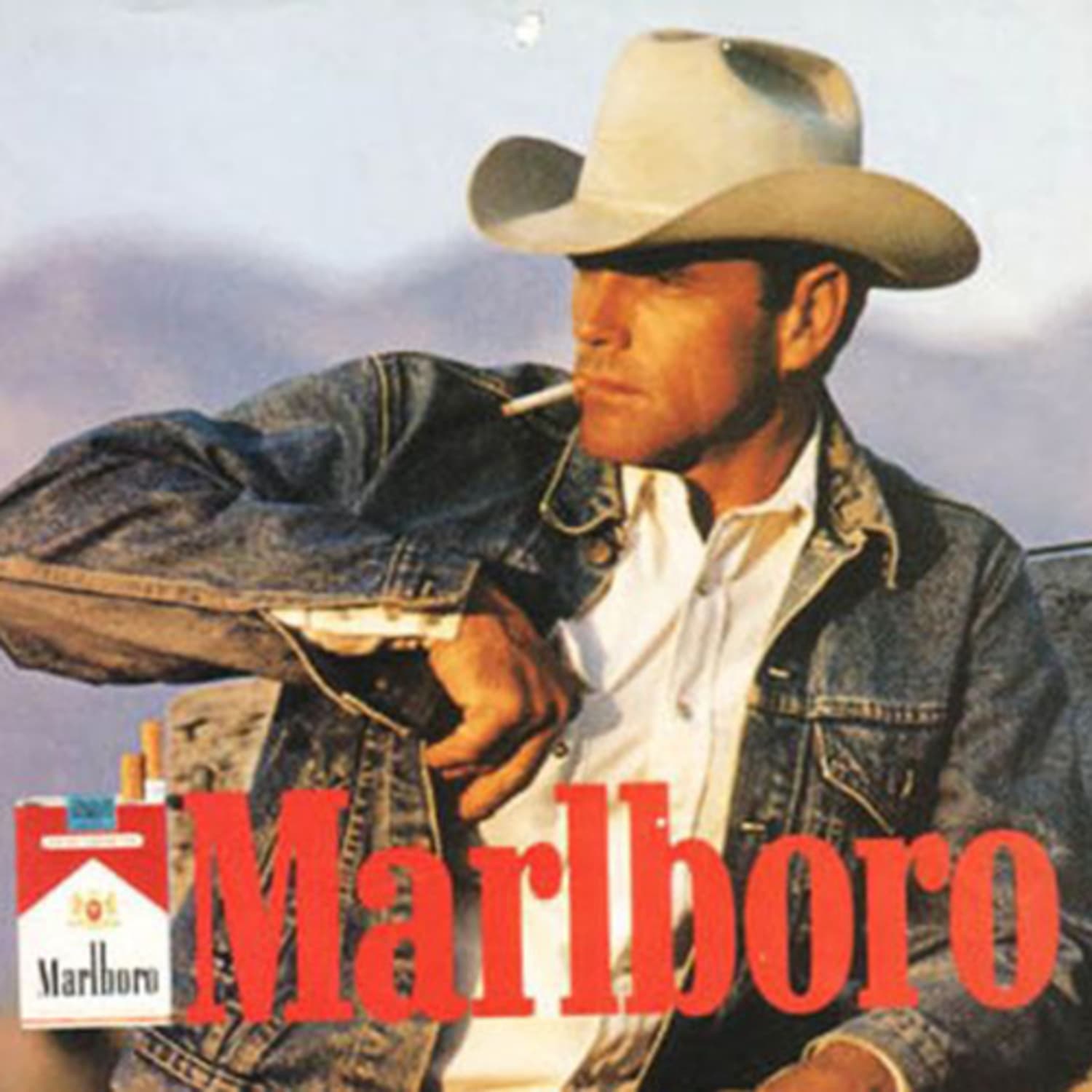 Man in cowboy hat smoking a cigarette in classic American ad for Marlboro