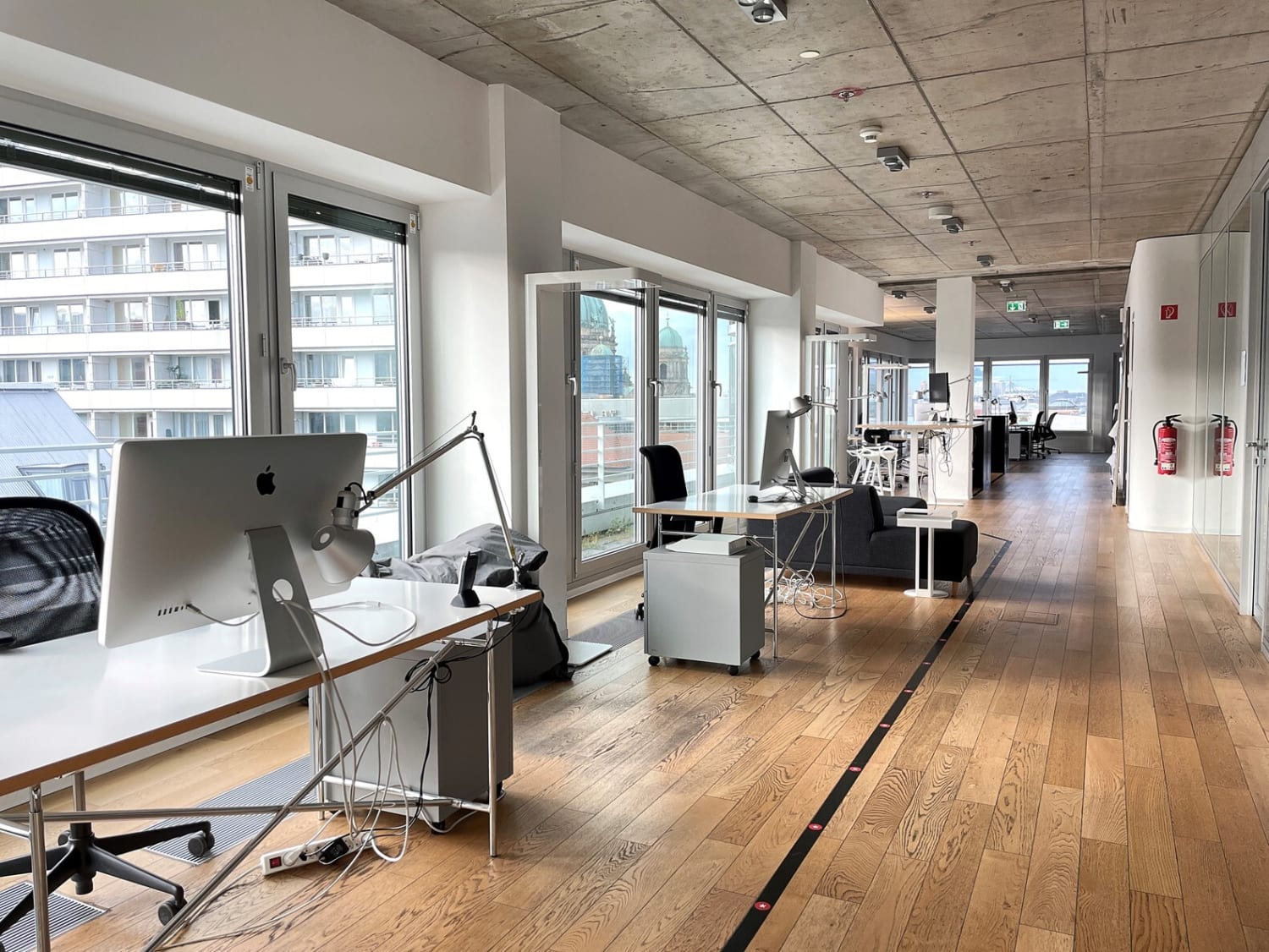 Spaced out desks, with an impressive view outside of the office