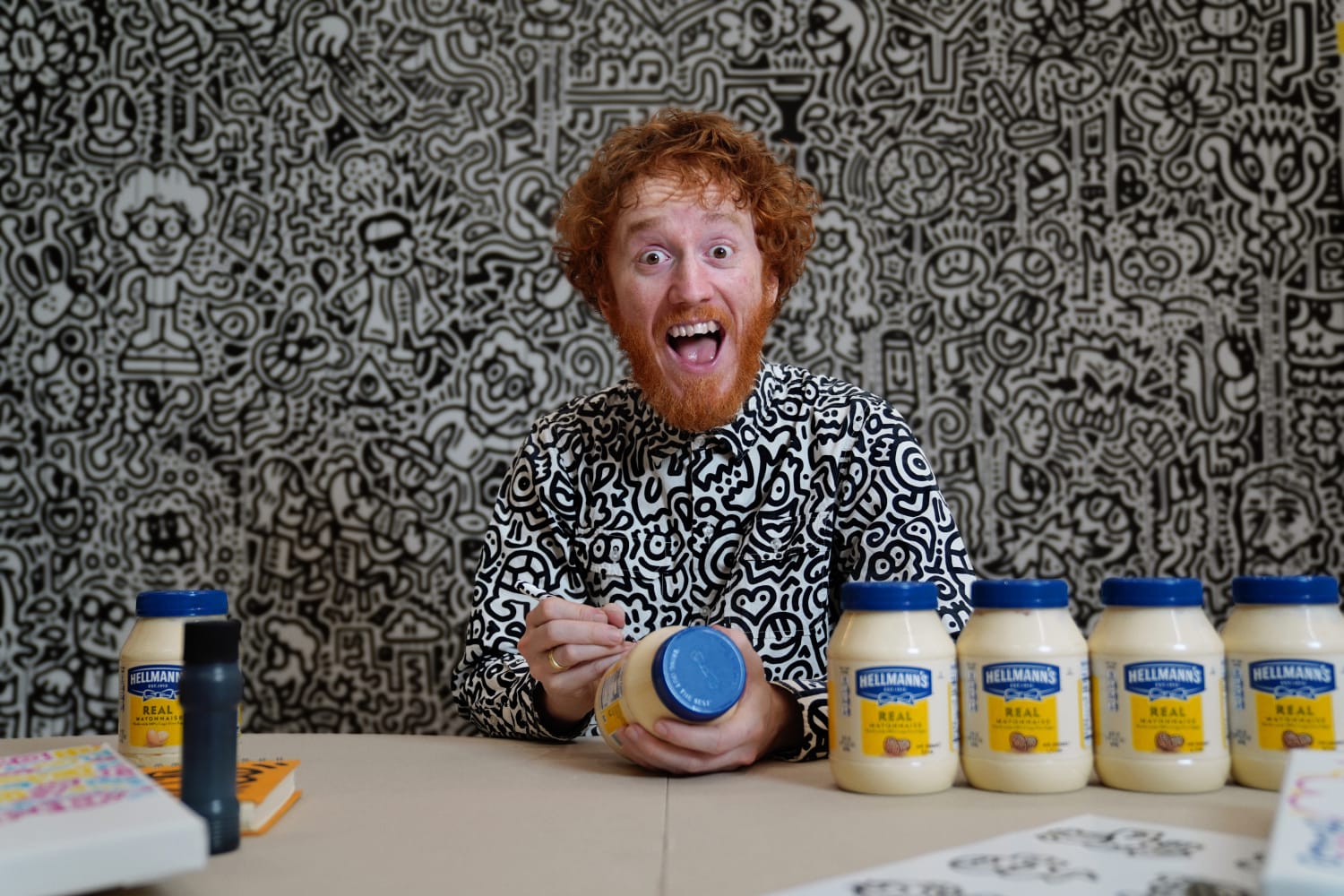 Mr. Doodle signing Hellmann's Mayo Jars