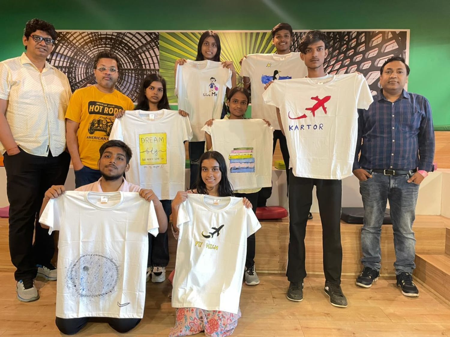 VML ES team participating in a group T shirt painting activity during Foundation Day