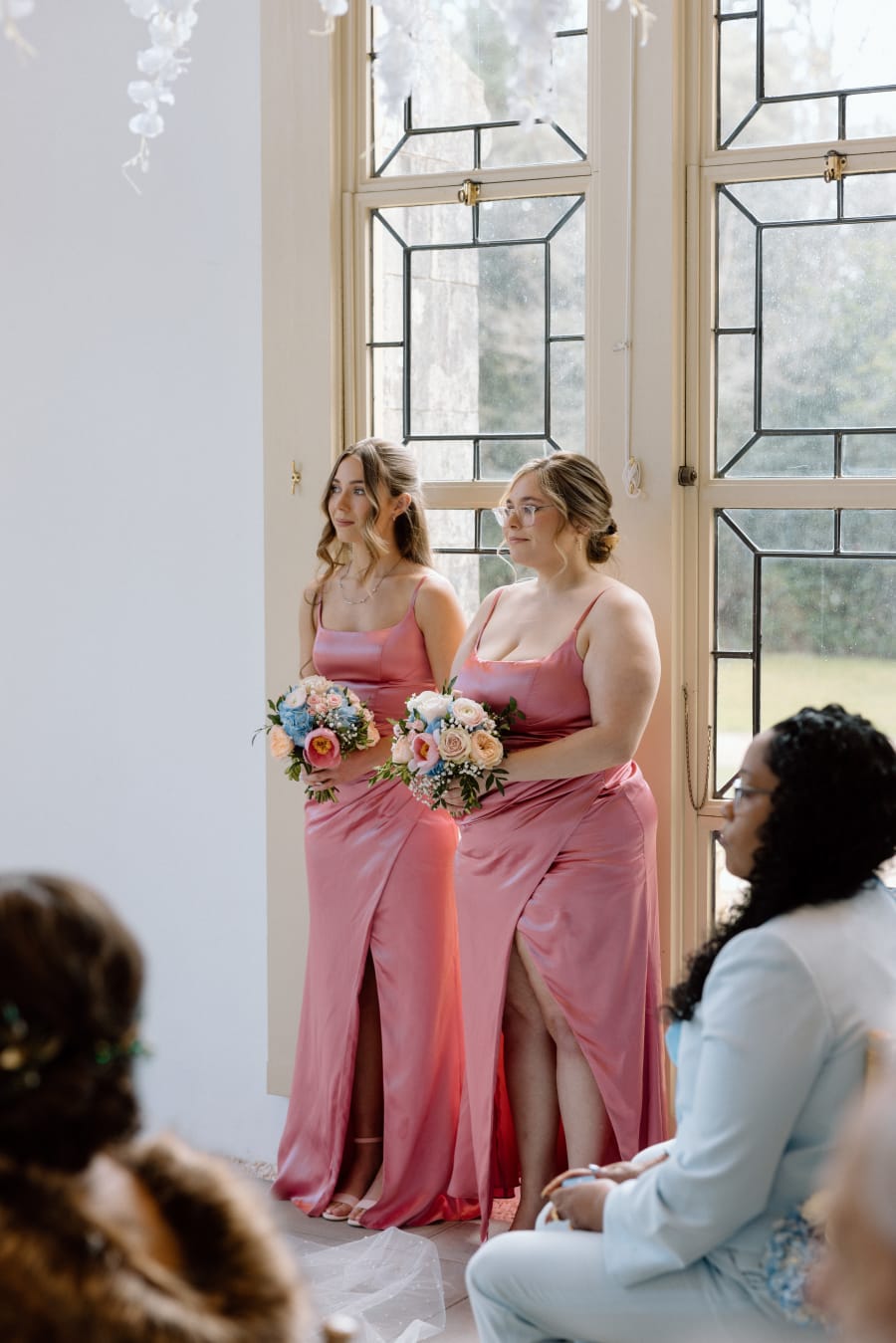Bridesmaids in pink watching the ceremony, Highcliffe Castle, Christchurch