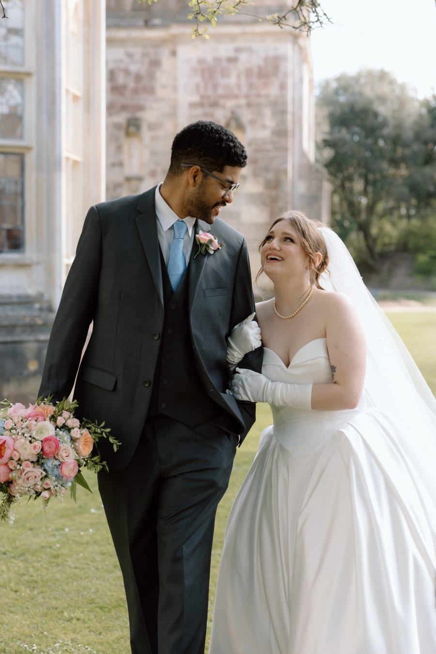 Karter and Ernzo laughing together, her bouquet in hand, Highcliffe Castle, Christchurch