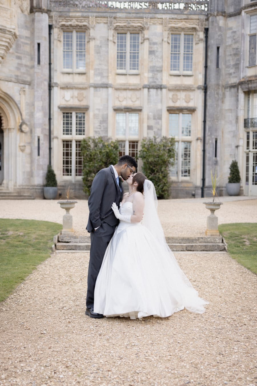 Karter and Ernzo kissing on the gravel in front of the castle, Highcliffe Castle, Christchurch