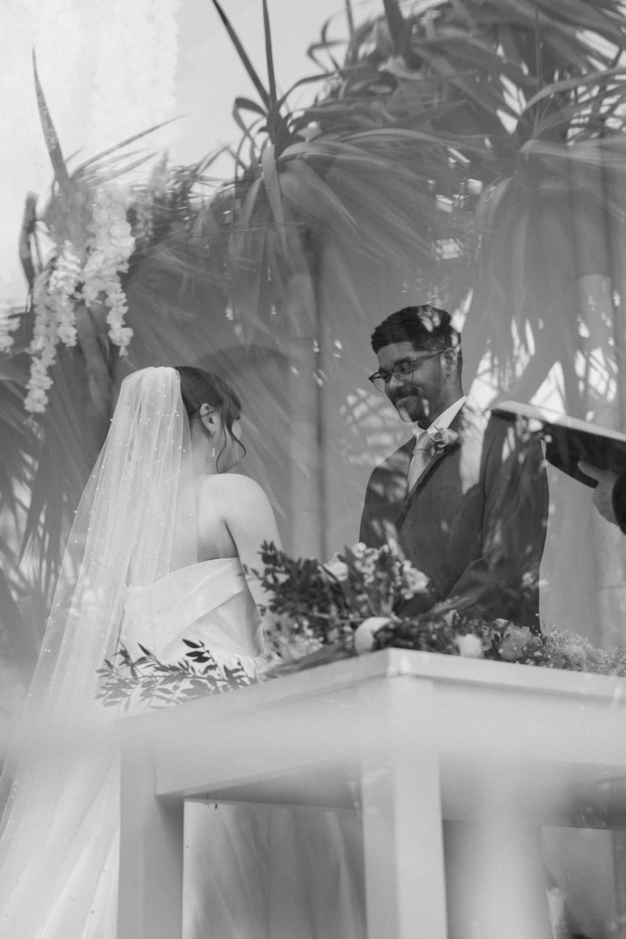 The ceremony glimpsed through the foliage, in black and white, Highcliffe Castle, Christchurch