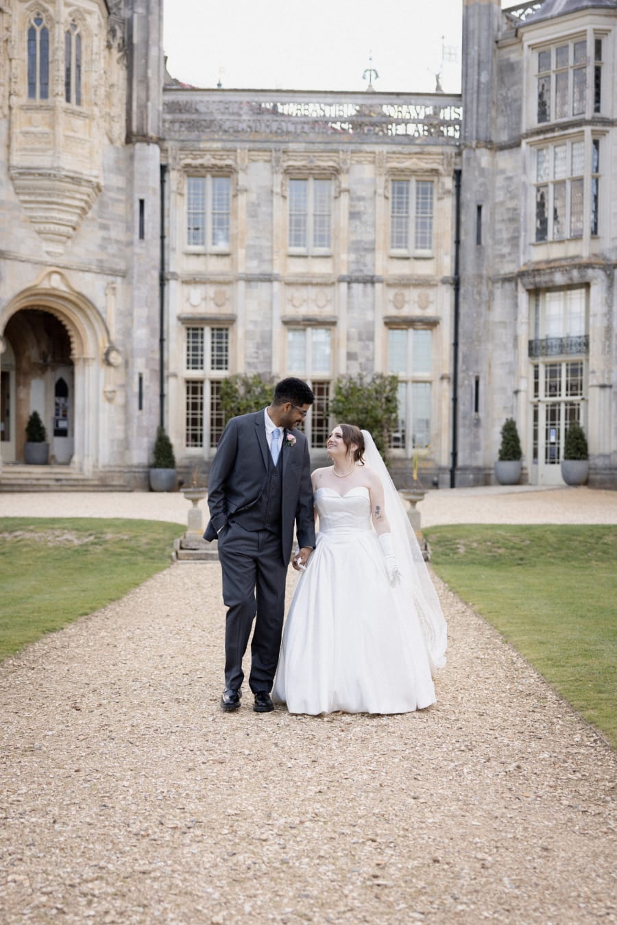 Karter and Ernzo walking hand in hand up the drive to the castle, Highcliffe Castle, Christchurch