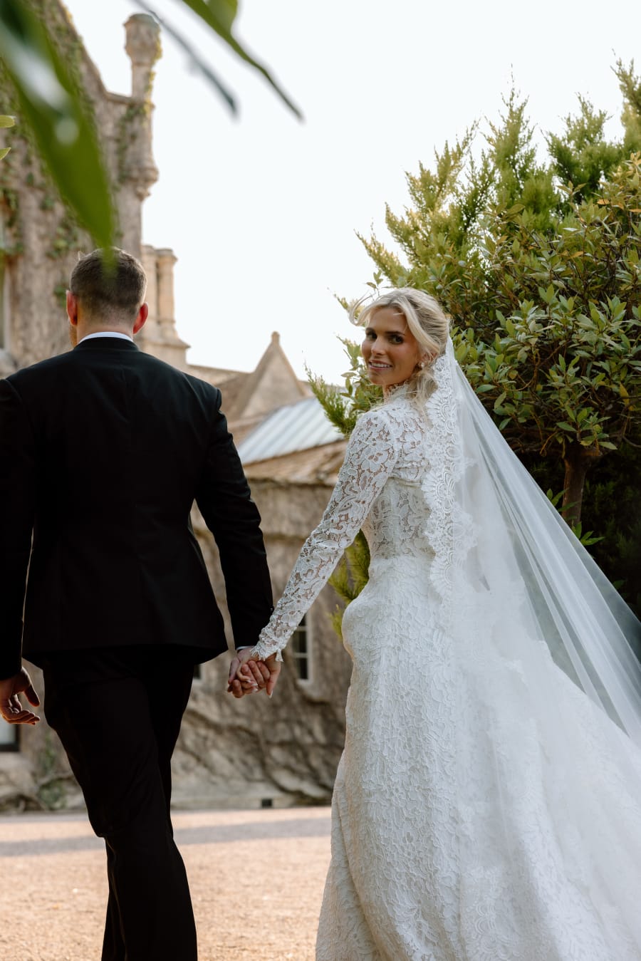 Morgan glancing back over her shoulder as she and Josh walk hand in hand, The Cotswolds