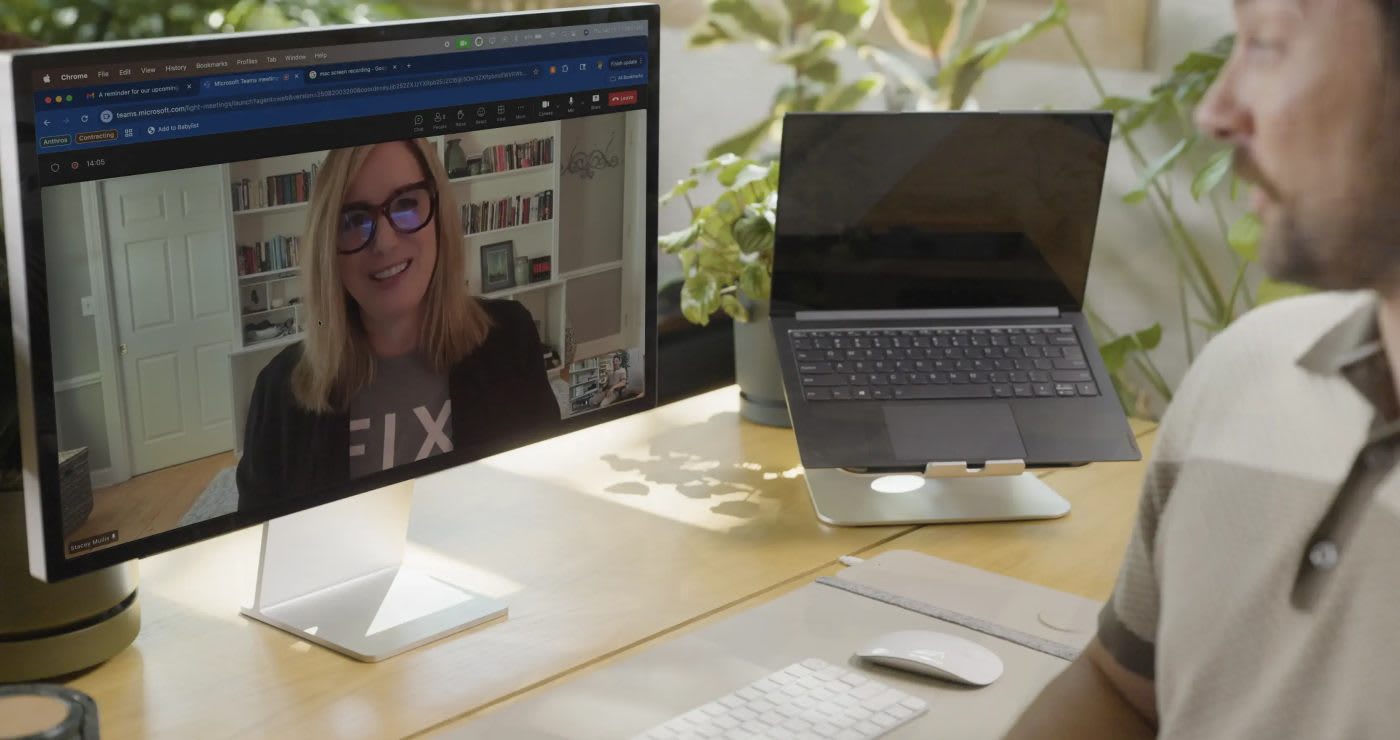 A customer on a video call with an Anthros therapist, shown on his desktop monitor
