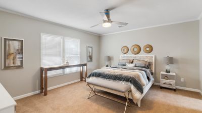 Spacious master bedroom with carpet and fully tape and textured walls