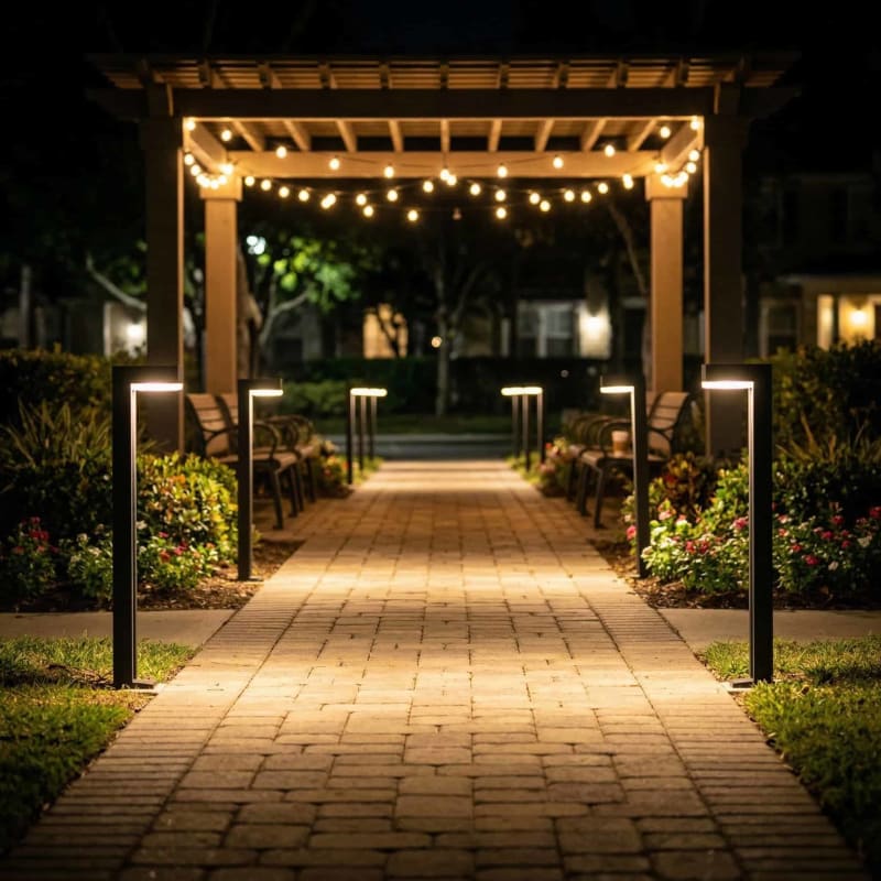 Pro-Line Bollard lights along a pergola walkway at night
