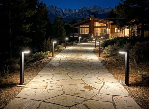 True Lumens™ solar bollard lights on a landscape pathway with bright 4000K dusk-to-dawn lighting