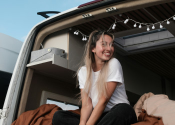 Smiling vanlifer woman daniel-j-schwarz-h-dYo2YC3nQ.jpg