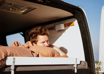 Lying on bed rear doors vanlife frank-van-hulst-tOOtigjBaZs.jpg