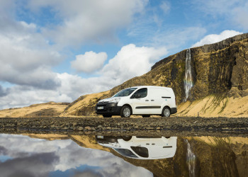 Minicargo van life parked lakeshore mountains waterfall kuku-campers-593102524.jpg