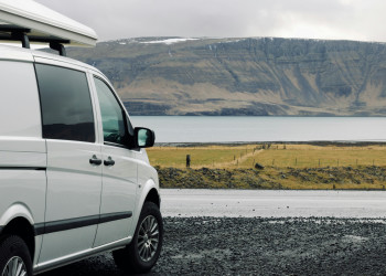 Minicargo van parked near lake roof storage kuku-campers-593102524.jpg