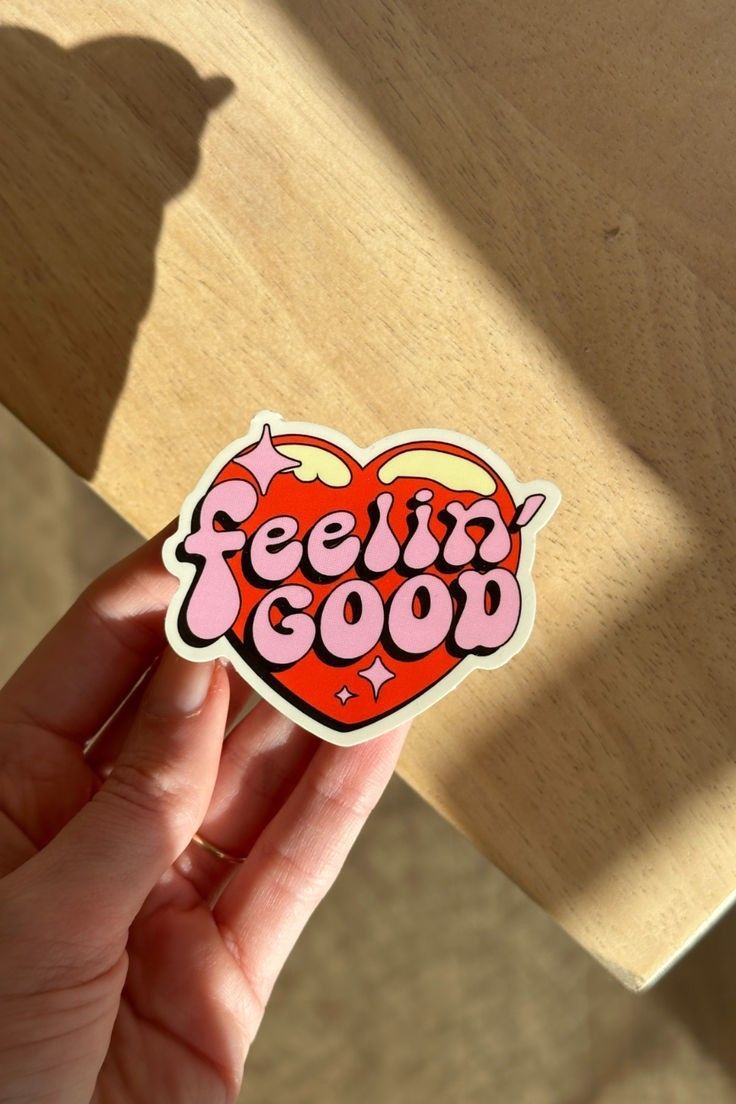Retro heart sticker with feelin good typography in warm colors