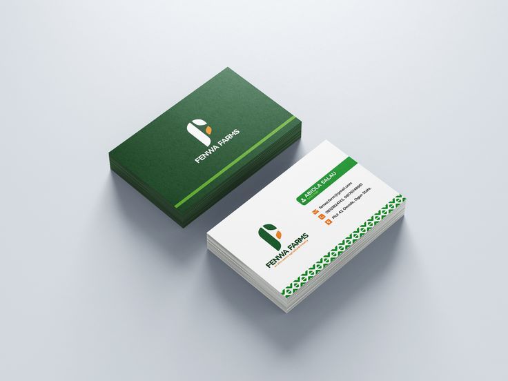 Stack of forest green and white business cards for an agricultural company featuring a leaf monogram logo