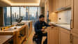 Professional carpentry services in Dubai – Karigar UAE carpenter installing custom wooden cabinets