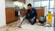 Professional deep cleaning services in Dubai – Karigar UAE technician steam cleaning kitchen tiles