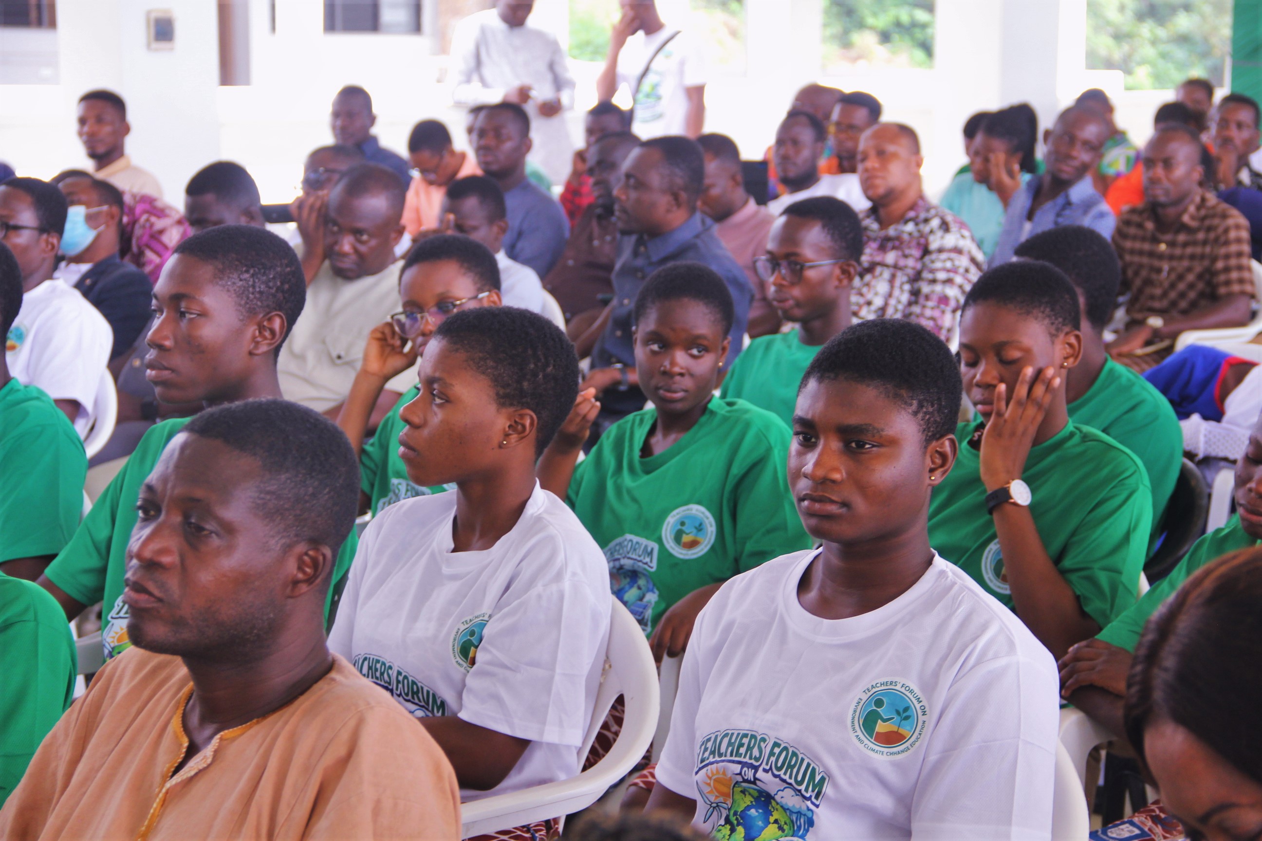 Students and teachers listening attentively during a lecture