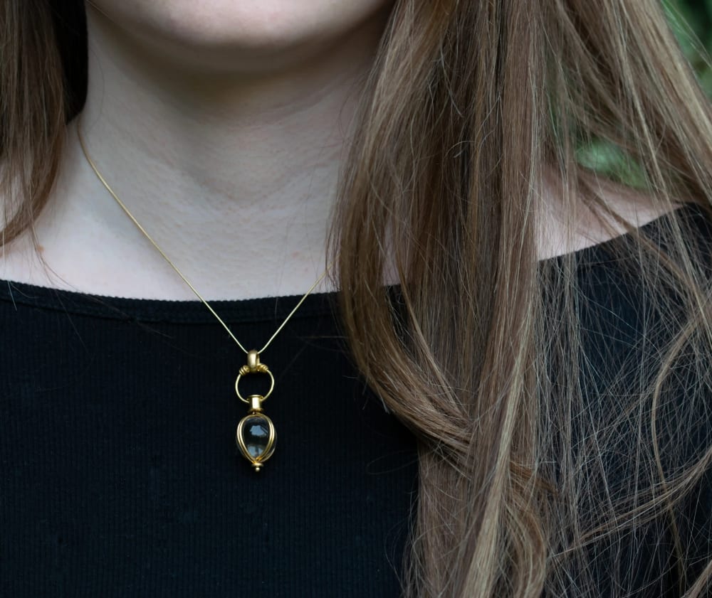 Phone photo of a Polly Gasston signature pendant, as the brand sent it
