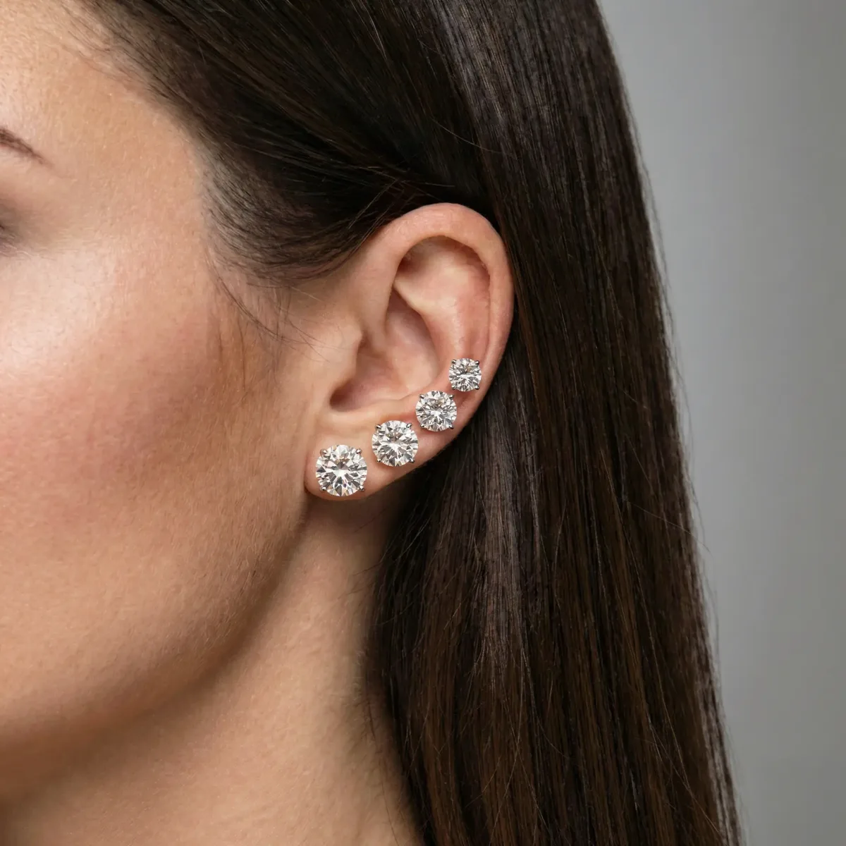 Four diamonds climbing the ear from the lobe up, side view
