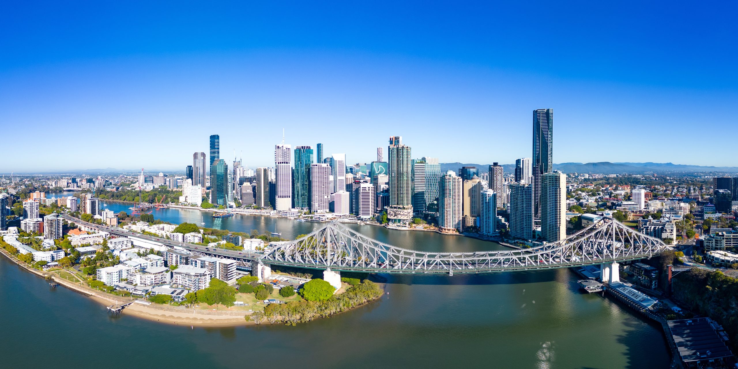 Brisbane CBD skyline and the Story Bridge; the new Olympic stadium is planned for nearby Victoria Park