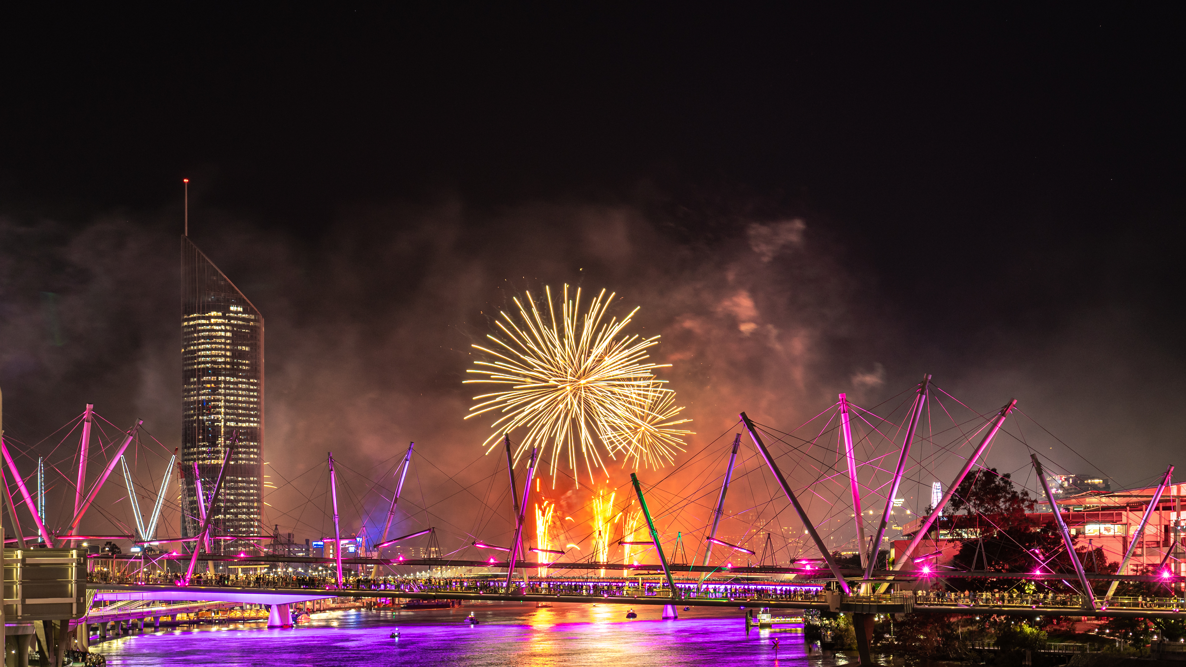 Fireworks over the Brisbane River at night