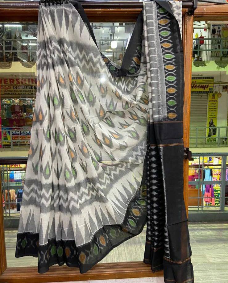 Elegant fashion photoshoot of woman in flowing organza saree