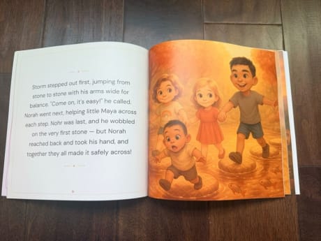 An open personalized storybook showing children crossing stepping stones across a river