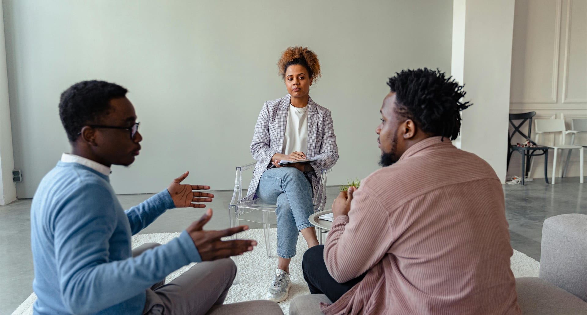 A mediator and two people talking