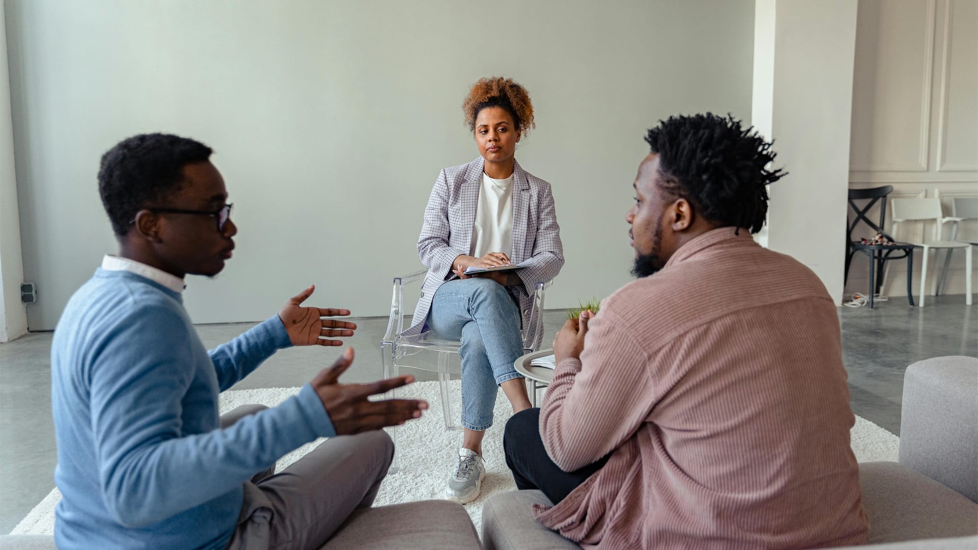 A mediator and two people talking