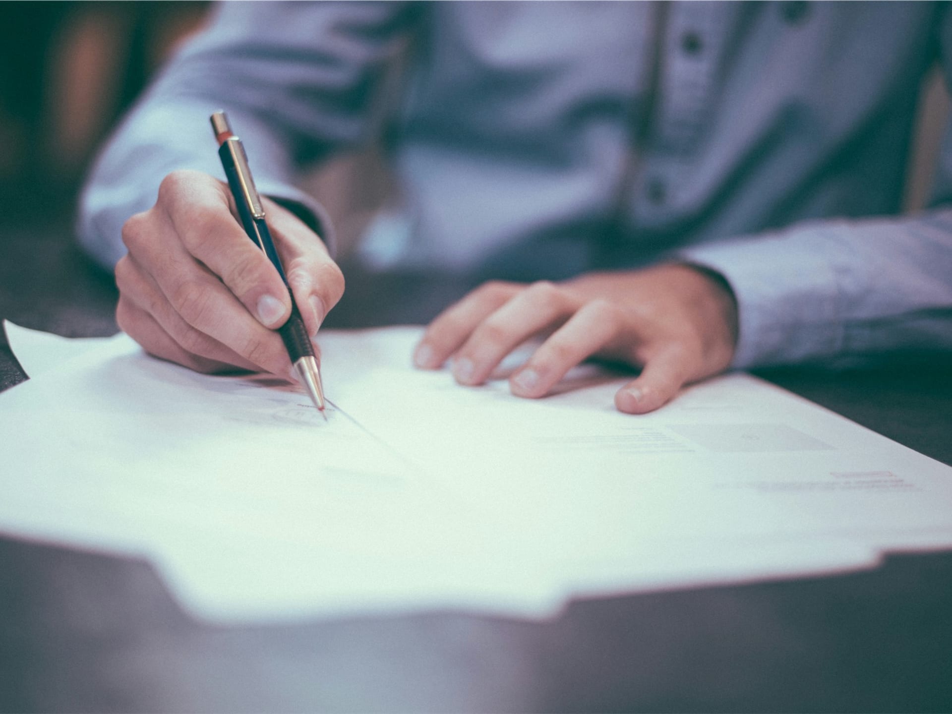 Legal documents and pen representing Claim Forms for small debt claims