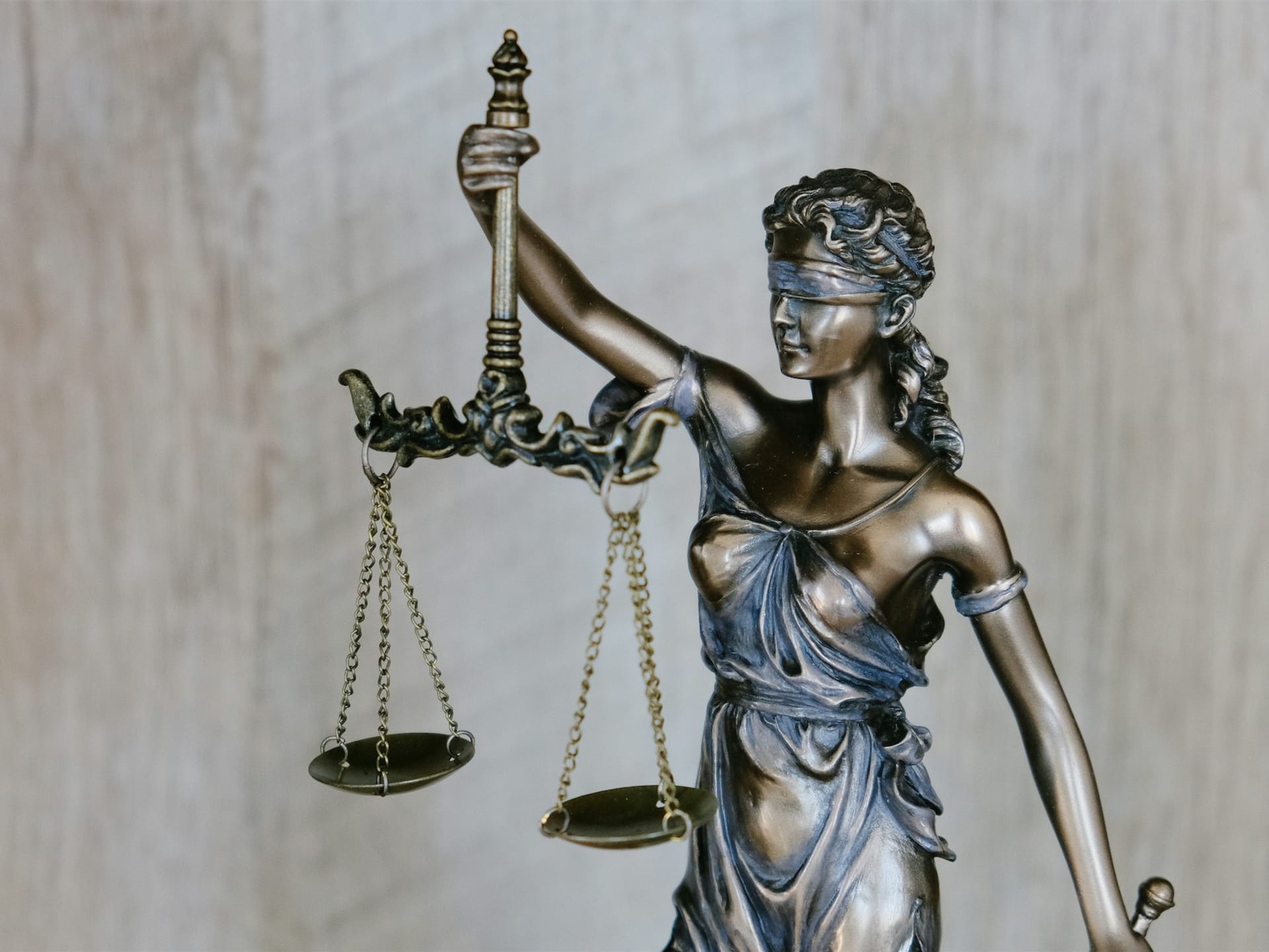 Legal scales and documents representing the balance between debt and damages claims