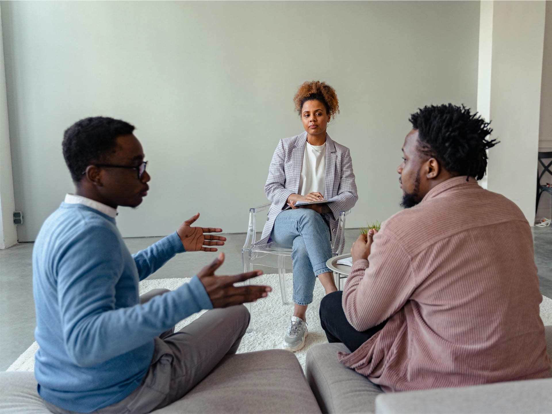 A mediator and two people talking