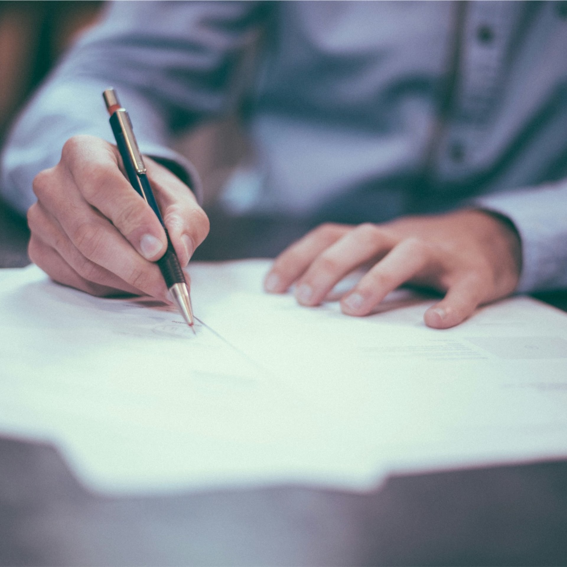 Legal documents and pen representing Claim Forms for small debt claims