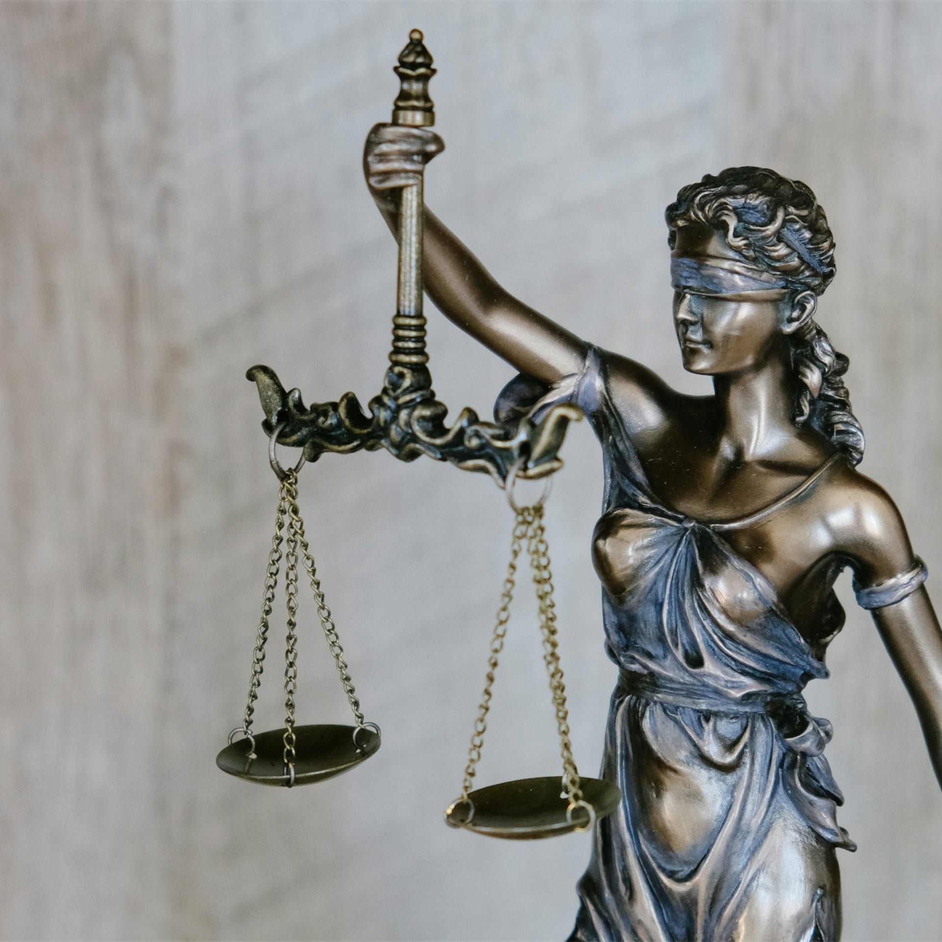 Legal scales and documents representing the balance between debt and damages claims