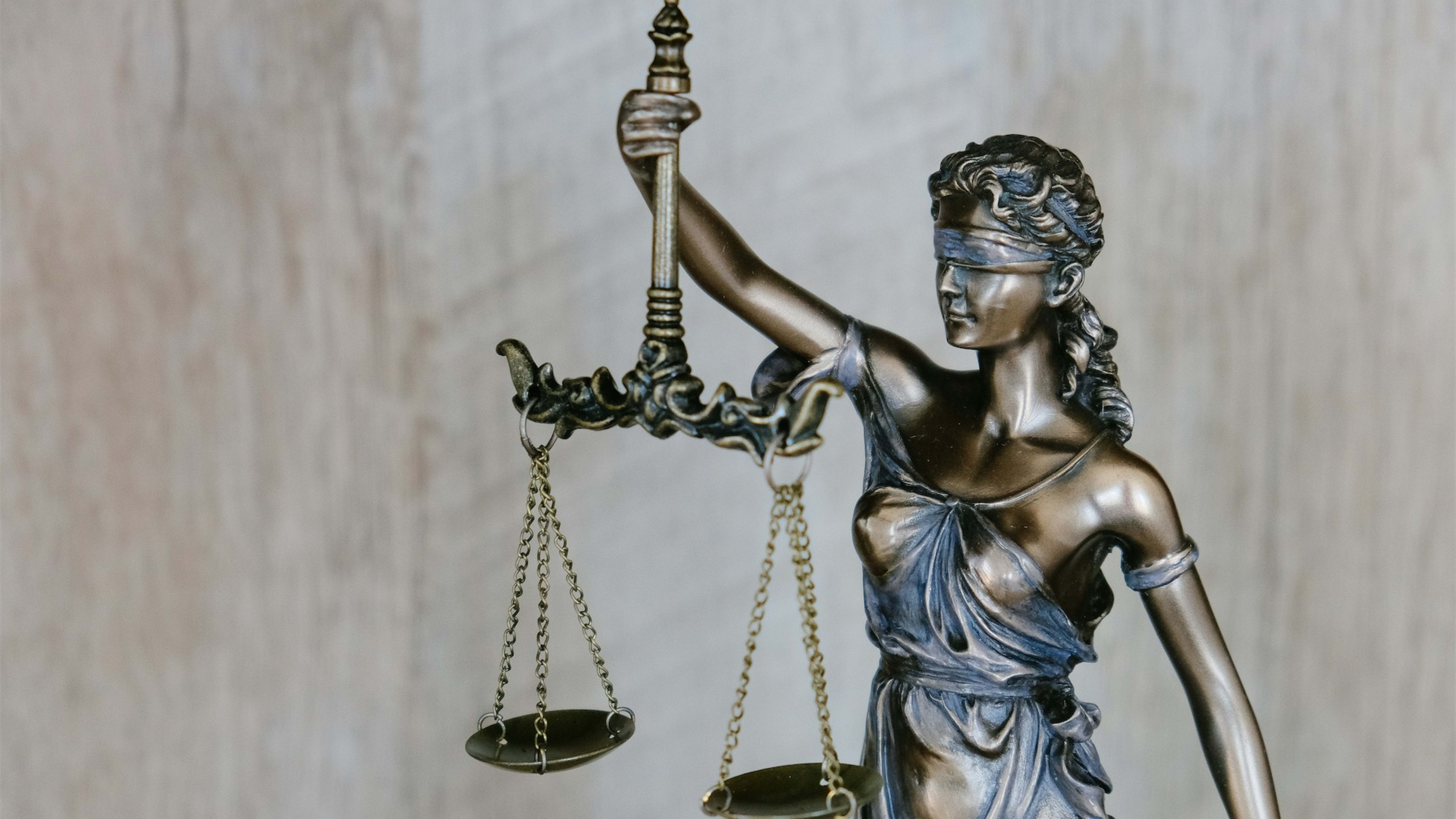 Legal scales and documents representing the balance between debt and damages claims