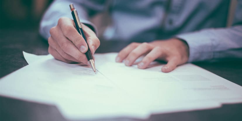 Legal documents and pen representing Claim Forms for small debt claims