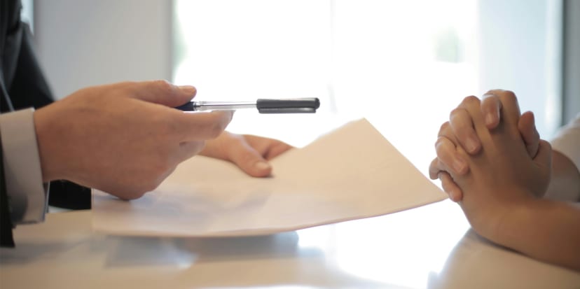 Legal documents and calculator representing costs in small claims cases