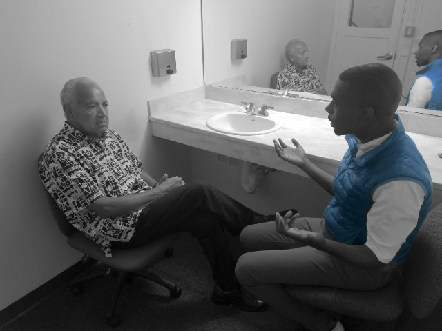 Dr. Martin Luther King's barber, Mr. Nelson Malden, talking backstage about the civil rights movement with Black Lives Matter leader, DeRay McKesson.
