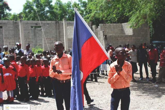SOLCEF, Inc. Raising the flag before school starts.