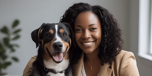 Happy dog owner with well-trained dog showing successful training relationship