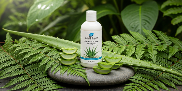 Earthbath Oatmeal and Aloe Shampoo bottle surrounded by green plants