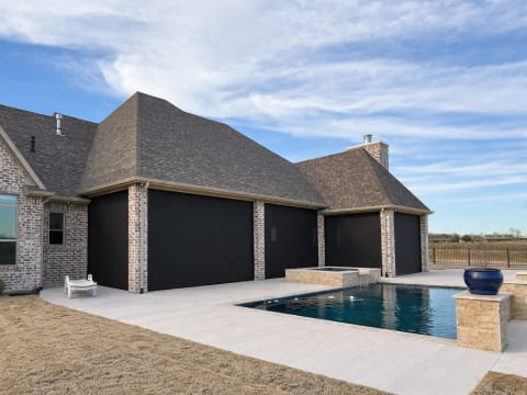 V-Track covered porch enclosure in The Woodlands, Texas