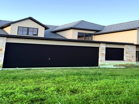 V-Track motorized screen on residential home